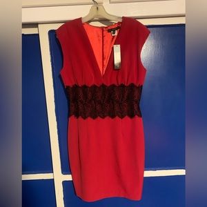 Single brand red dress size 10. Low V-Neck line. Lace detail around the waist.
